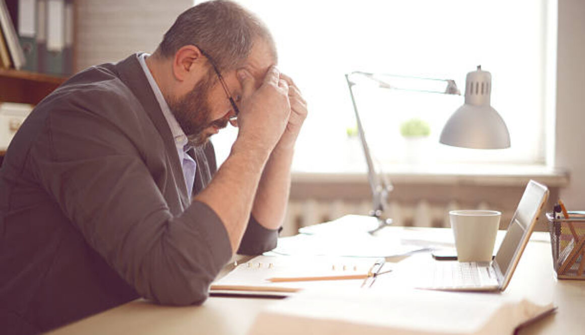 Mature Adult man working in the office